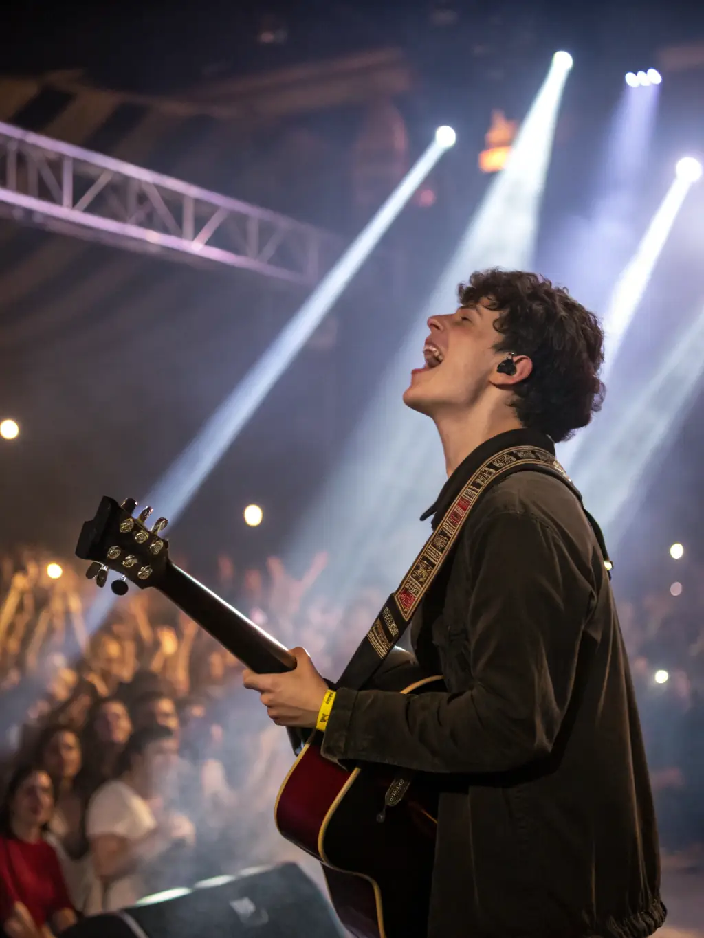 A dynamic image of a live music event, showcasing an emerging artist performing on stage with an enthusiastic audience, capturing the excitement and energy of a live performance.